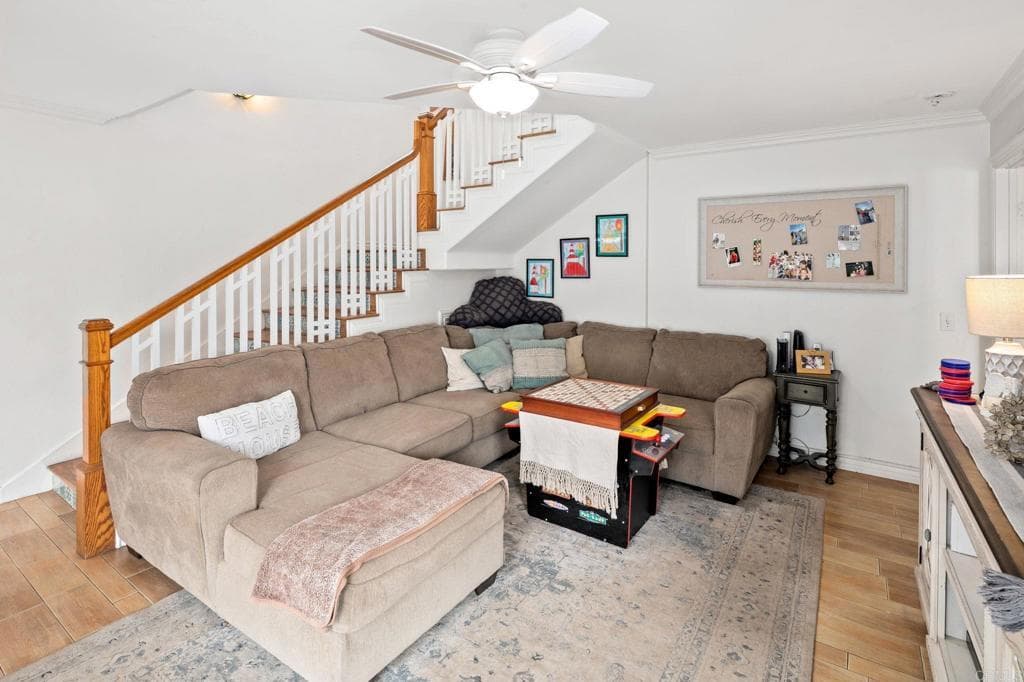 An open living room with marble coffee table and wainscoting (as-is)